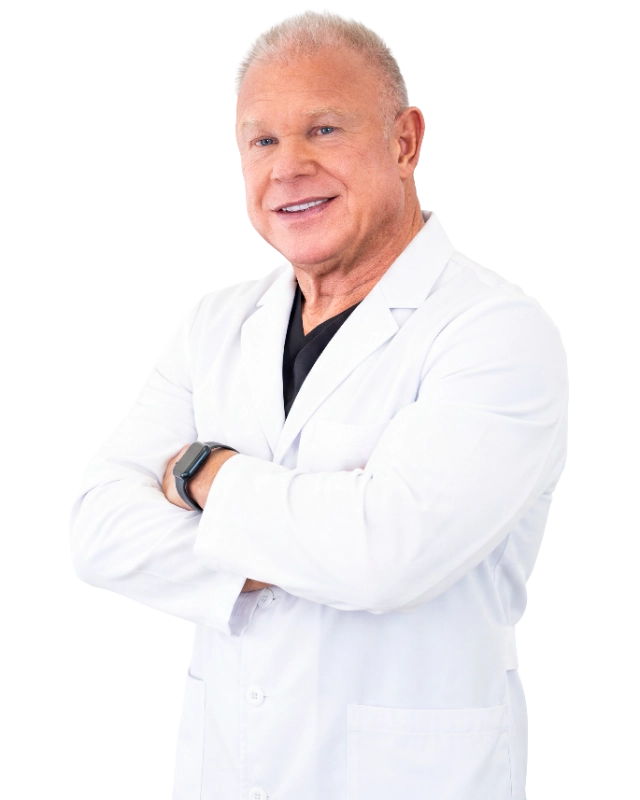 DrStone_Cutout_optimized Professional headshot of Dr. David Stone, MD, a mature male healthcare provider wearing a white laboratory coat over a black v-neck shirt, smiling at the camera against a black background. This clinical portrait represents his medical practice at VIP Medical Group.