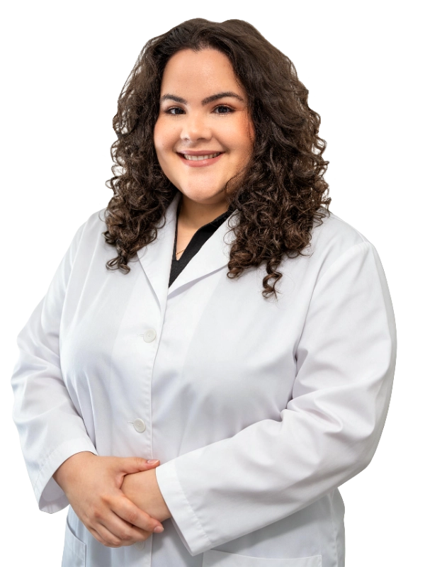 Professional headshot of Dr. Hanen Fernandez wearing a white lab coat, smiling at the camera against a grey background. This is a standard medical professional portrait used for clinic or practice identification.